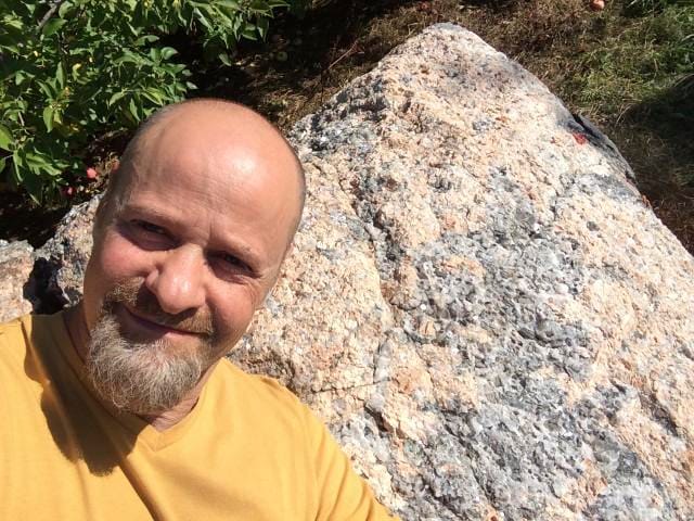 Kyle Russell in front of pyramidal Granite
