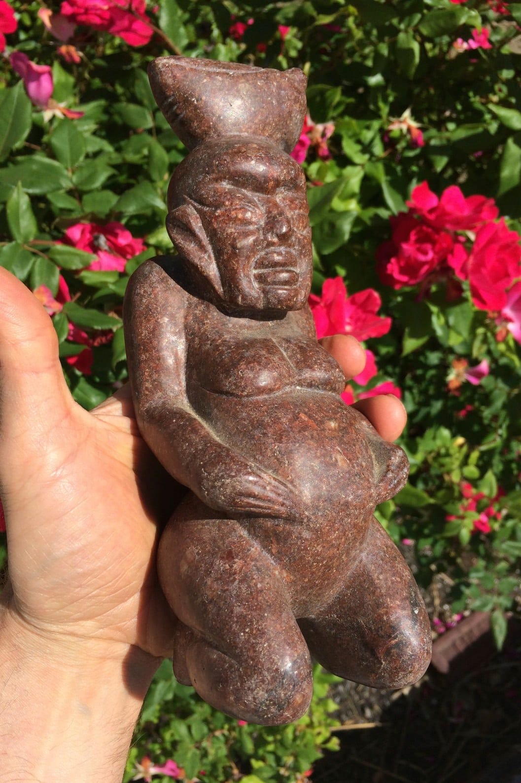 Granite (carving) kneeling tribal deity from Indonesia, healing crystal