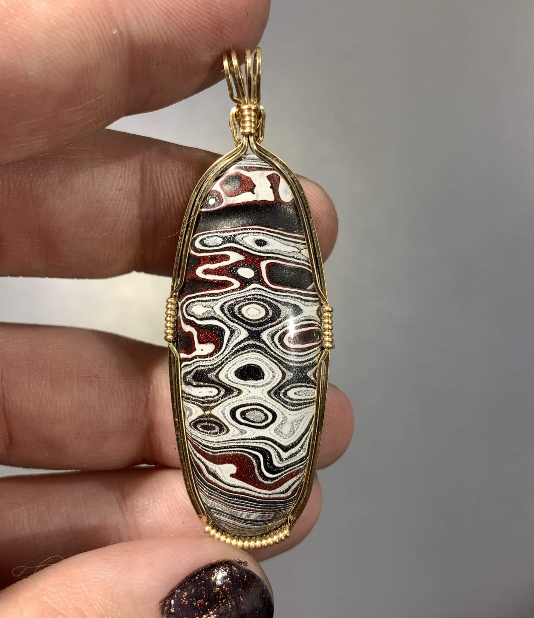 Fordite pendant for necklace - 'mask' - GF wire wrapped healing crystal