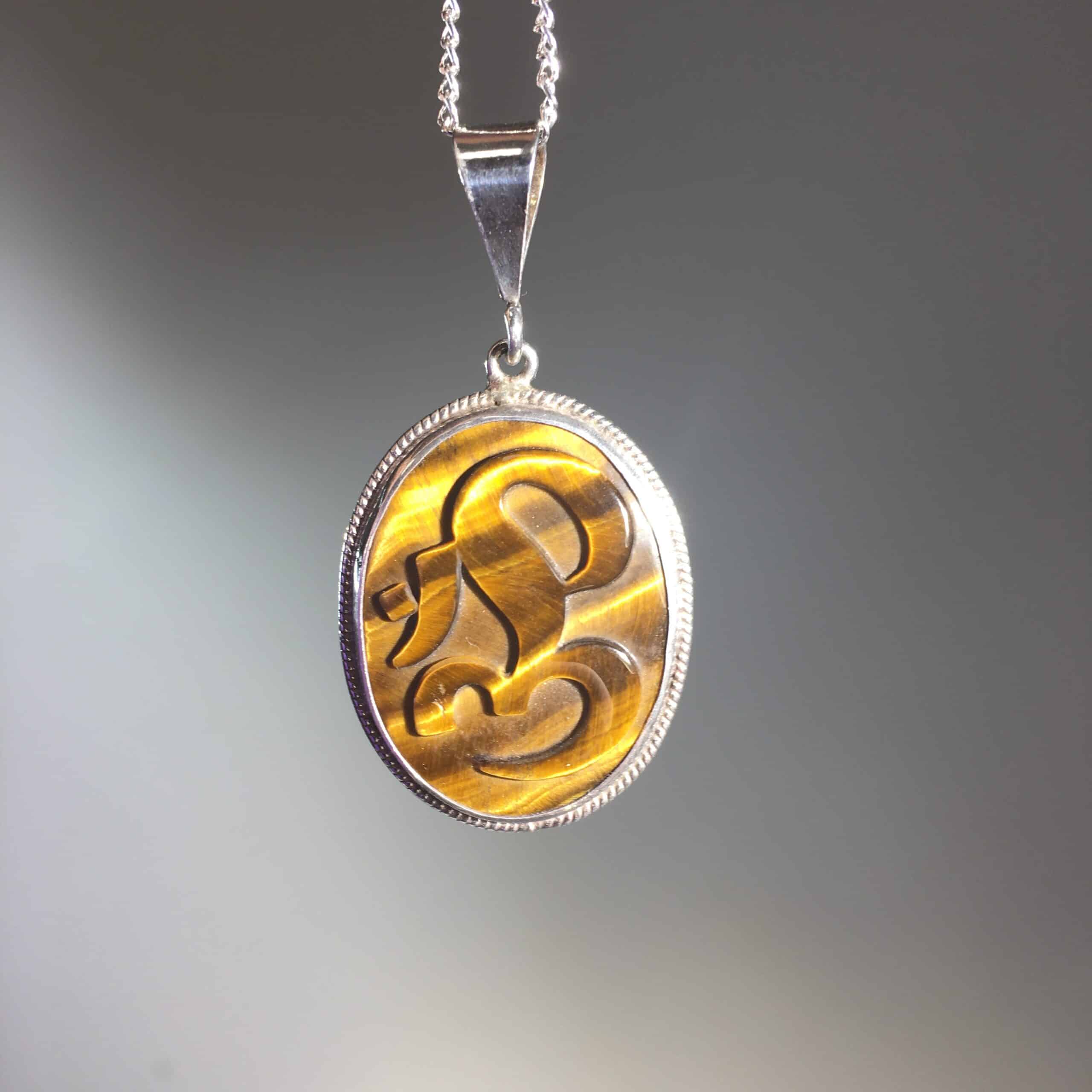 Tiger Eye 'Om' pendant for necklace healing crystal