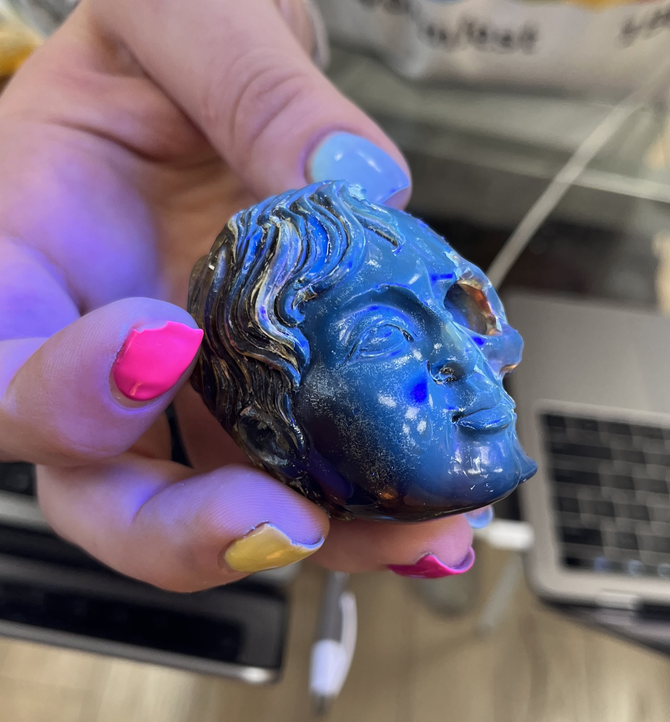 Amber (carving) blue fluorescent 'child skull within' healing crystal - Image 2