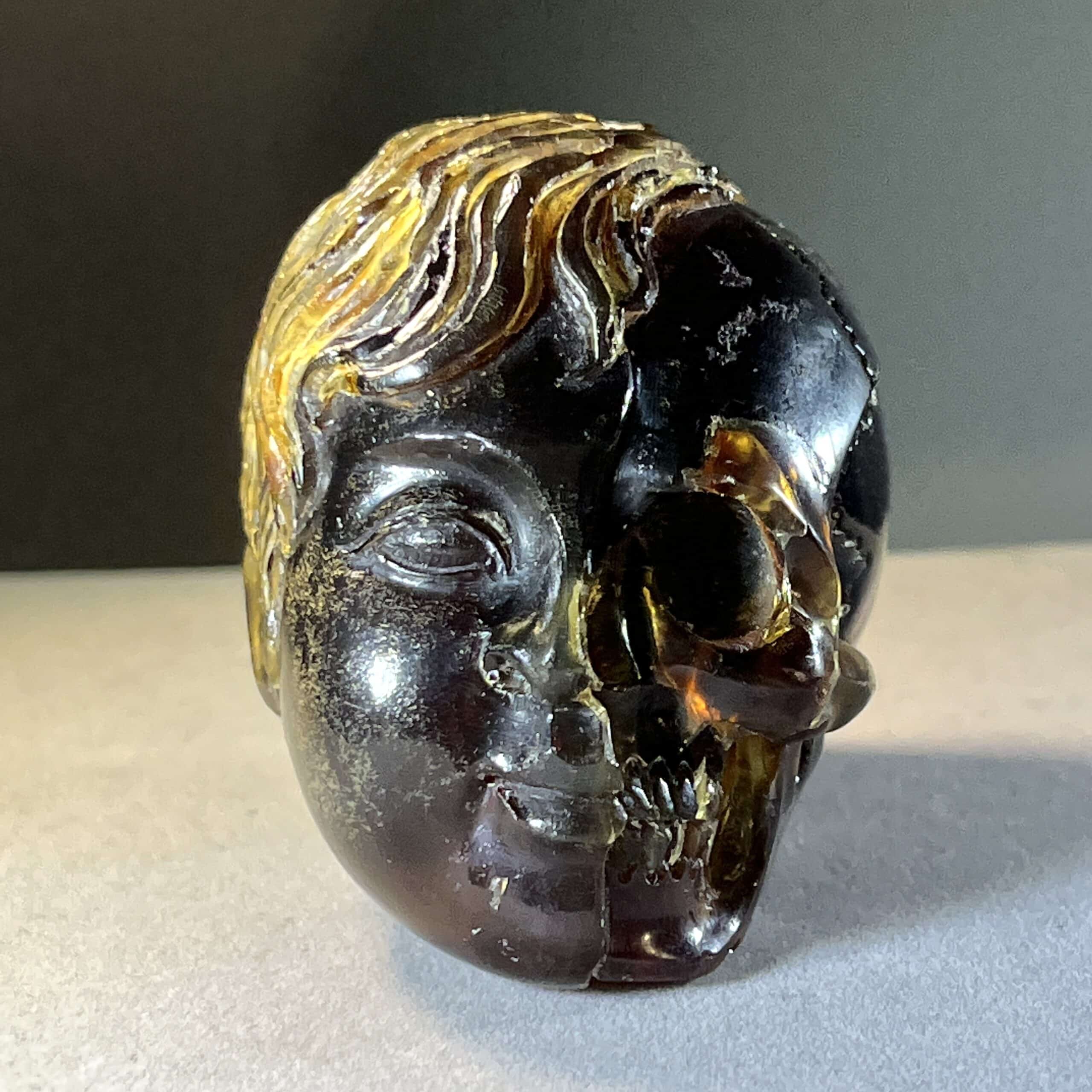 Amber (carving) blue fluorescent 'child skull within' healing crystal - Image 4