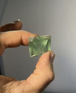 Fluorite (green) cleaved octahedron healing crystal