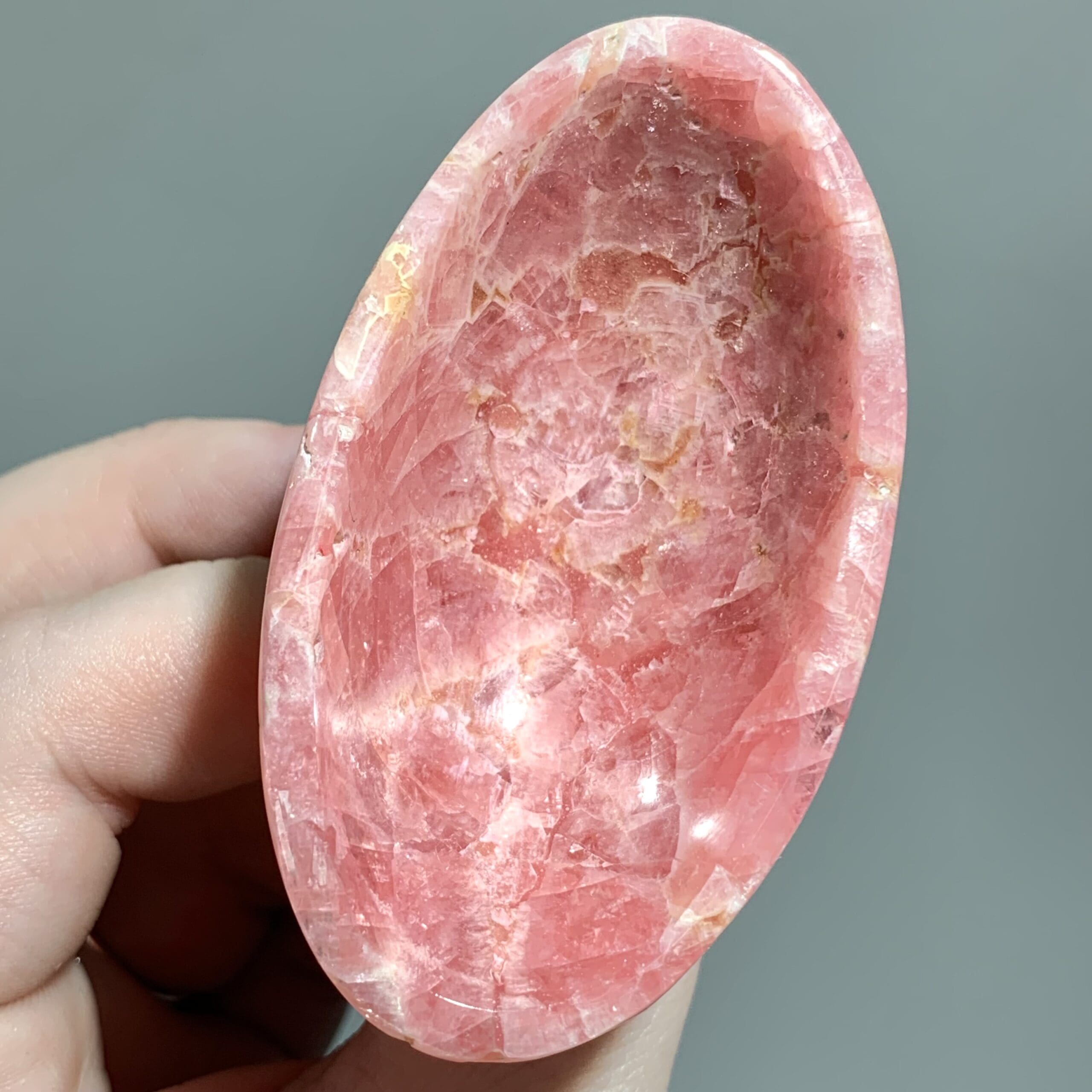 Rhodochrosite gemmy oval bowl w/ Basalt base healing crystal - Image 4