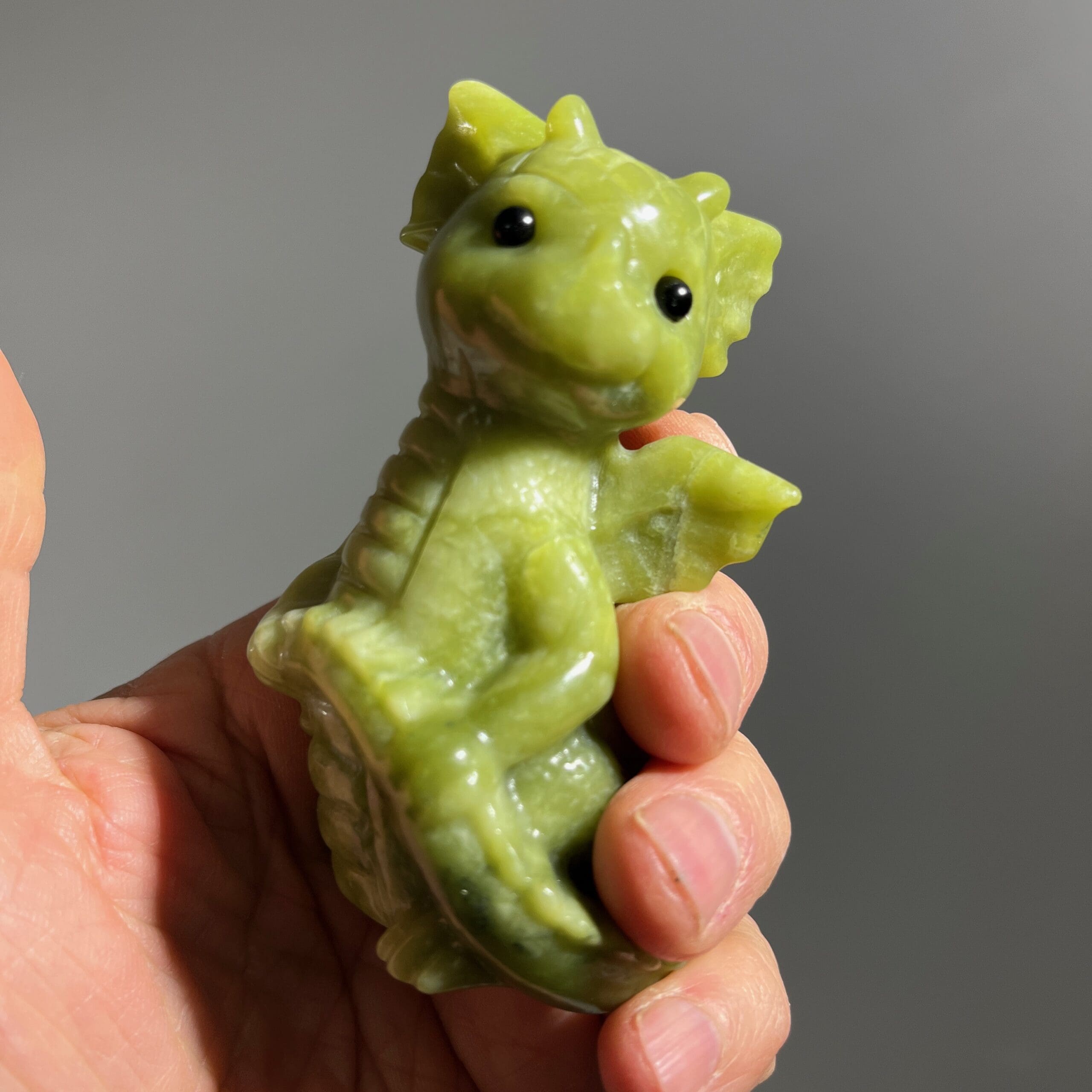 Jade-like (carving) Serpentine baby dragon, tail-in-hand, healing crystal